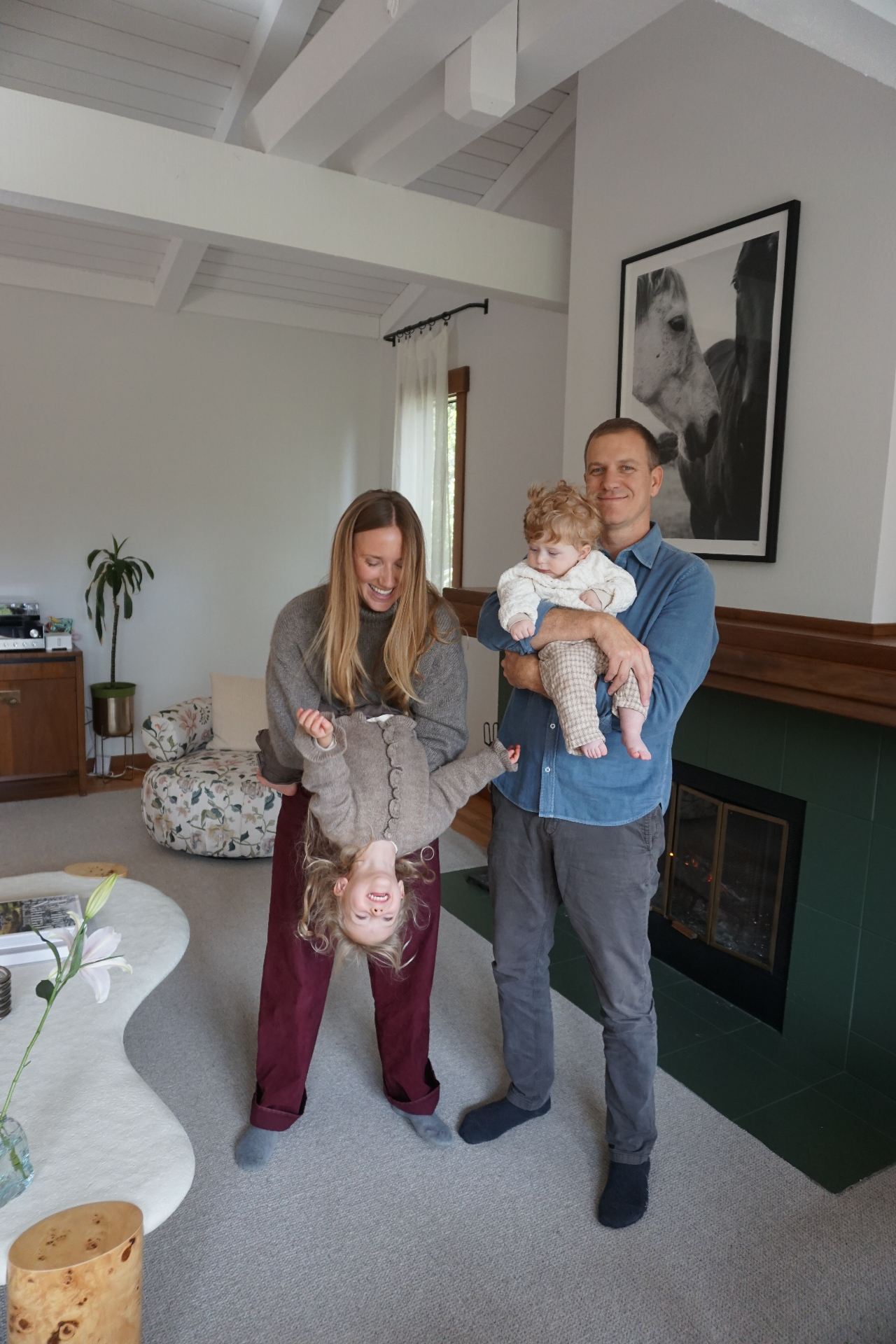The Fleischmann family gathered near the fireplace at home