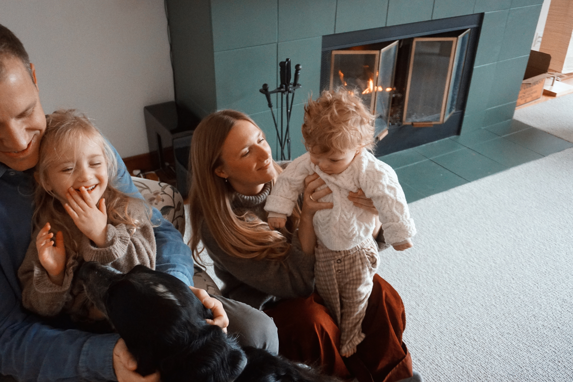 The Fleischmann family gathered near the fireplace at home