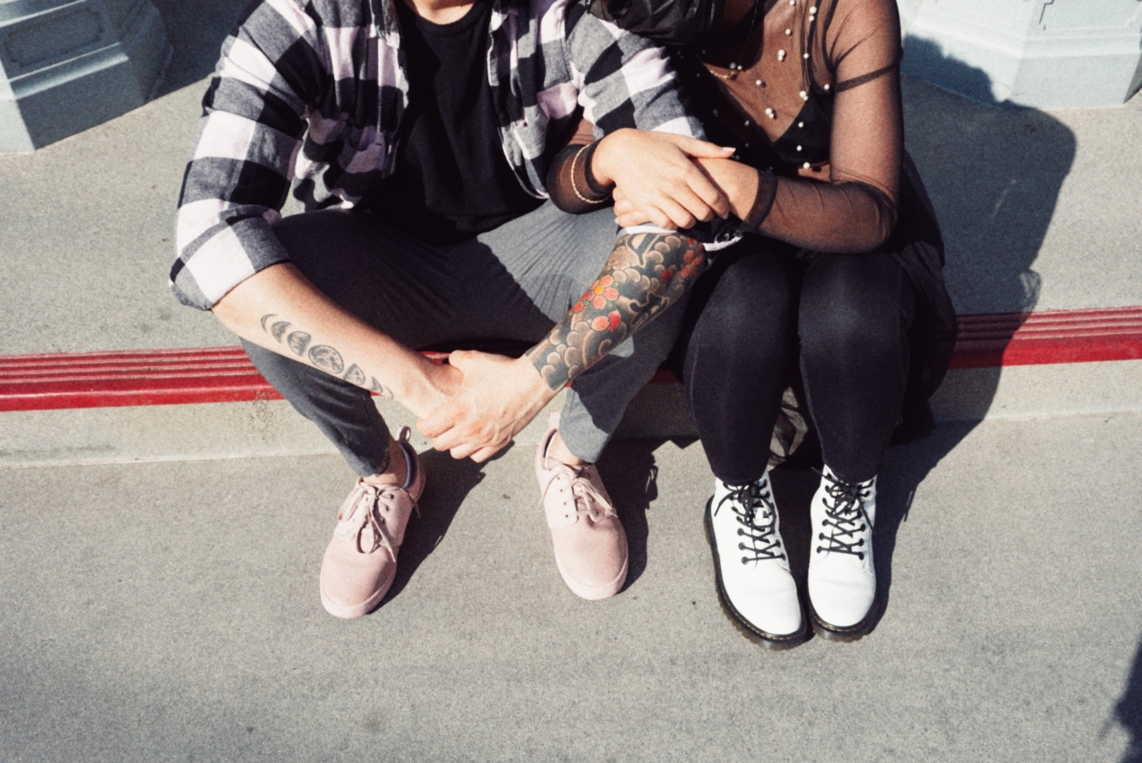 Close detail of Kim and Nick holding hands during their engagement photoshoot