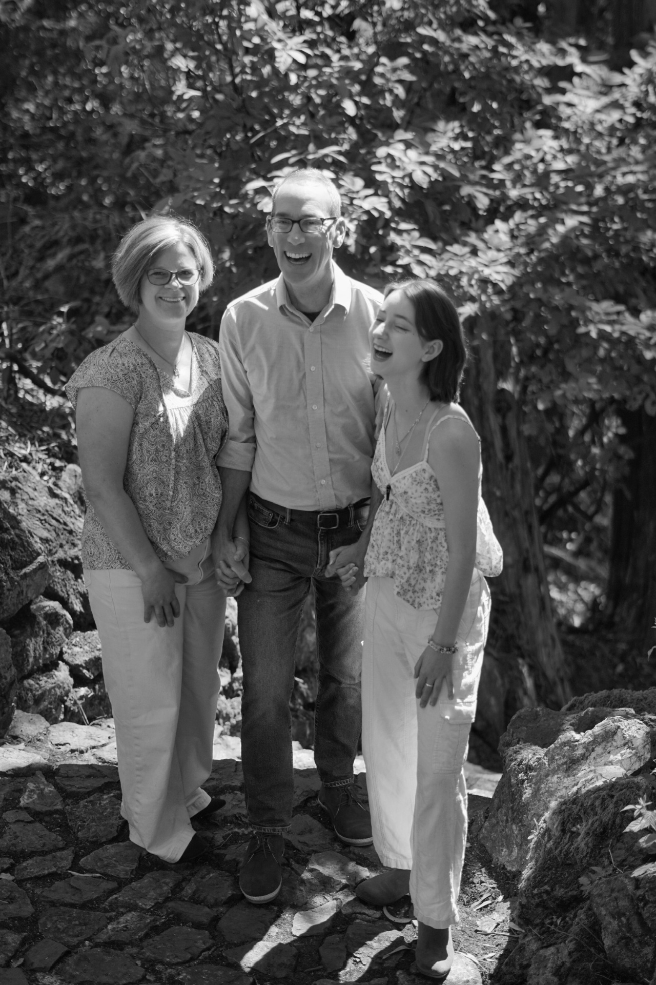The Trimble family laughing together on a wooded San Francisco path